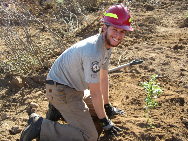 An AmeriCorps member does some planting on the Indian Valley Restoration project in California's Eldorado National Forest.