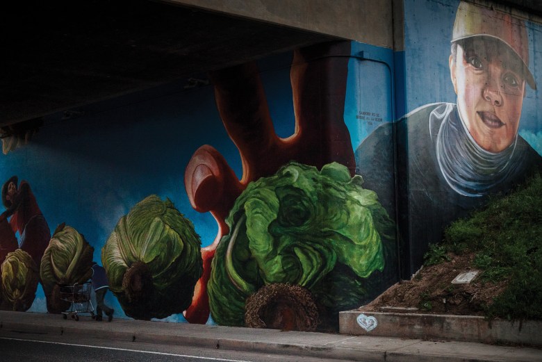 A mural in Salinas, California, shows farmworkers harvesting vegetables.