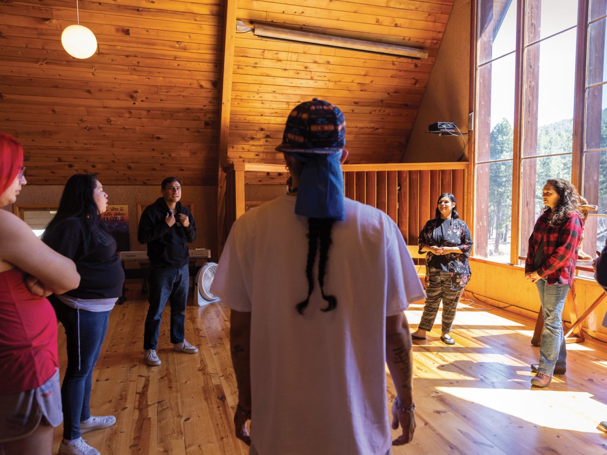 Cast members of Wicoun gather with Larissa FastHorse at the chapel  at Placerville Camp in the Black Hills of South Dakota.