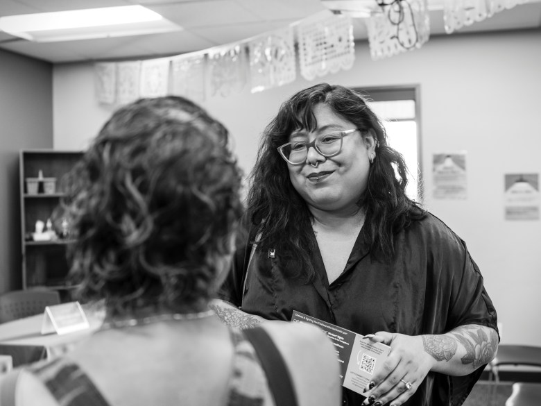 Washington State District 14 state representative candidate Chelsea Dimas visits with a potential voter after a candidate forum in Sunnyside, Washington, in July.