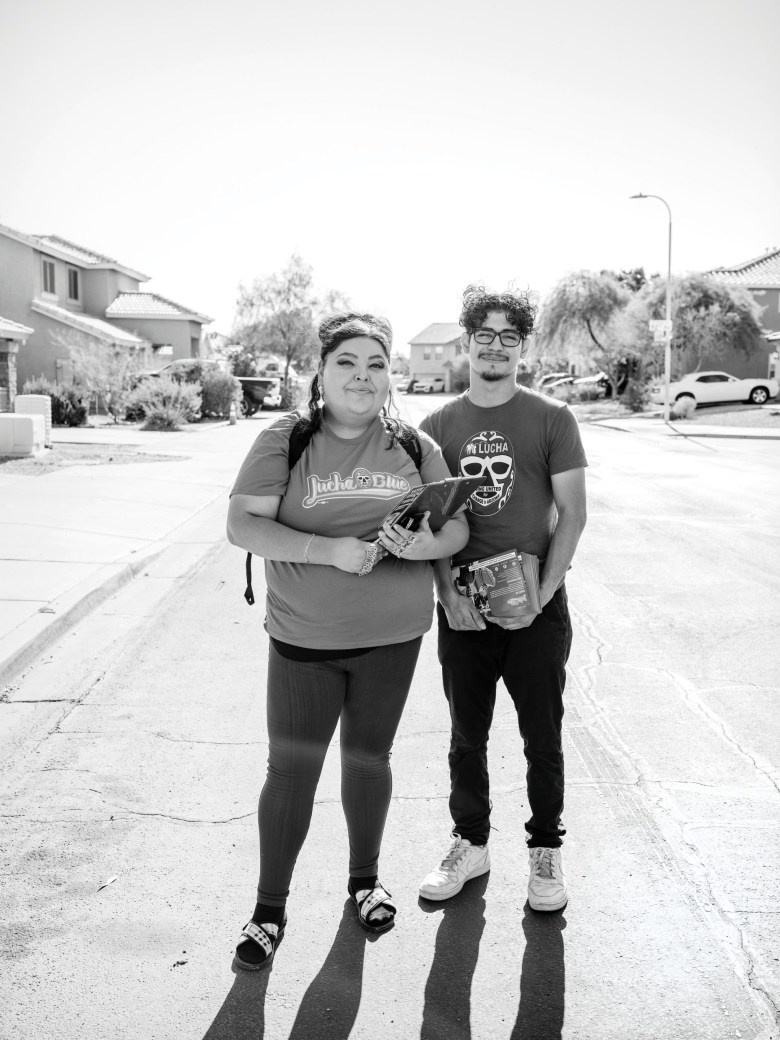 Living United for Change in Arizona (LUCHA) Organizing Director Gina Mendez and canvasser Isaiah Leal go door to door in late May in a Phoenix, Arizona, neighborhood to educate voters and encourage participation in this year’s local, state and federal elections.