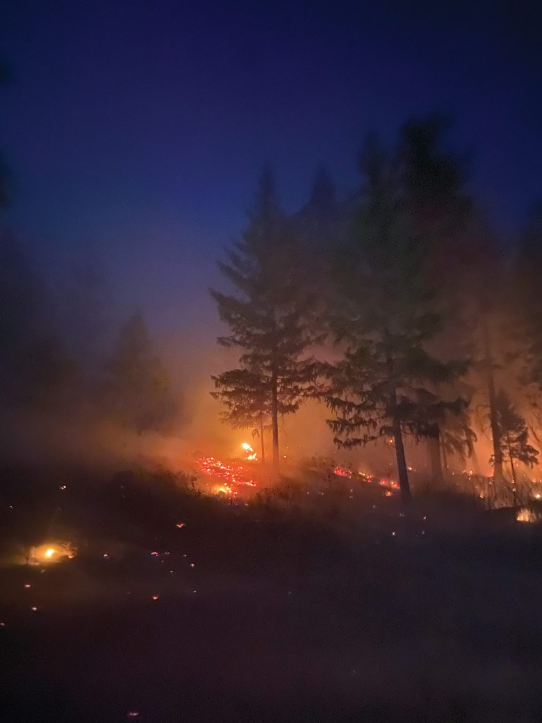 A prescribed fire burns into the night north of Chewelah, Washington, in October.