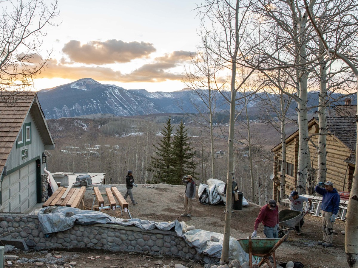 A construction crew works at a home in Mount Crested Butte, Colorado. Construction costs have soared across the country in the past few years and are especially high in mountain ski towns.