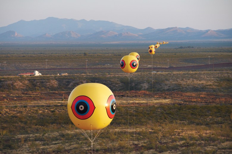 Repellent Fence – 2015.
Land art installation and community engagement (Earth, cinder block,
para-cord, PVC spheres, helium). Installation view, U.S.-Mexico border, Douglas, Arizona / Agua Prieta,
Sonora. Courtesy of Postcommodity.