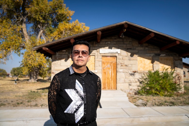 Jordan Dresser stands for a portrait in front of the former Arapahoe Cultural Museum.