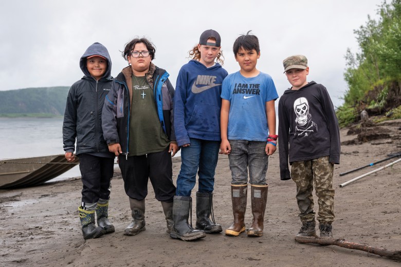 At culture camp along the Yukon River, Victor Williams, 10; Chris Williams, 9; Lian Martin, 11; Karl Nickoli, 9; Evrit Martin, 9, all of Ruby, Alaska, stand for a picture.