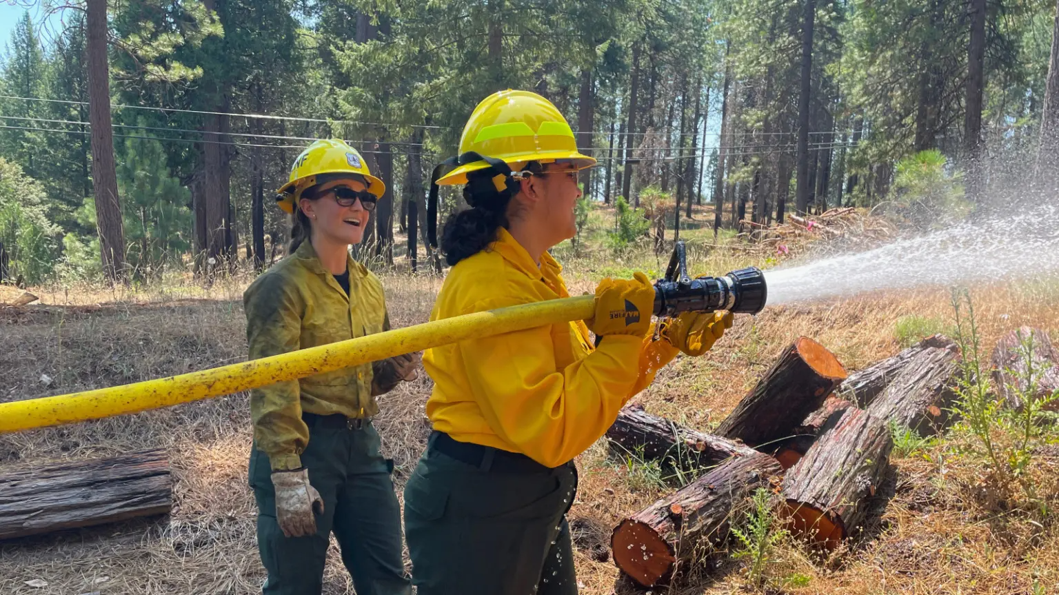 Two AmeriCorps NCCC Forest Corps members participate in field training in California last summer.